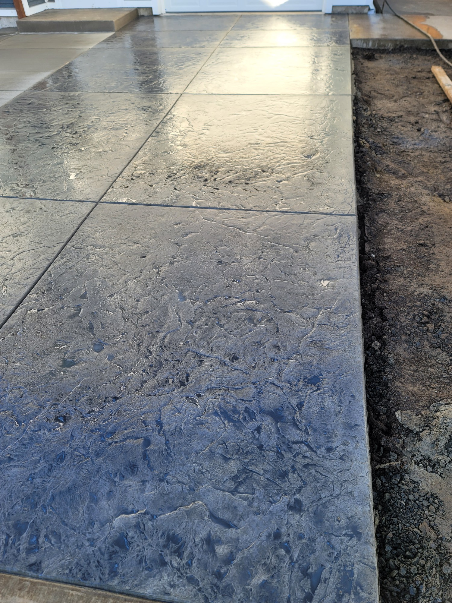 Decorative stamped concrete patio installed in Linn County Oregon by M2 Mini LLC